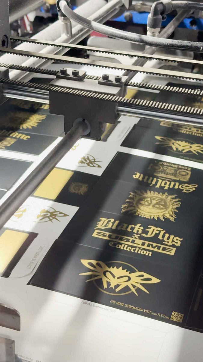 Image of Black Flys sunglasses boxes going through the SBL Platinum 106 diecutter.